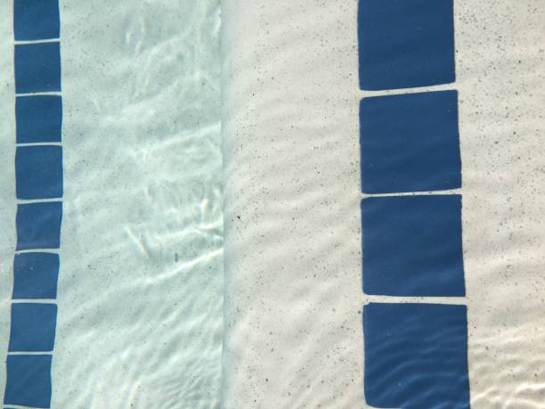 istock Edge of pool blue water stairs 1179435866