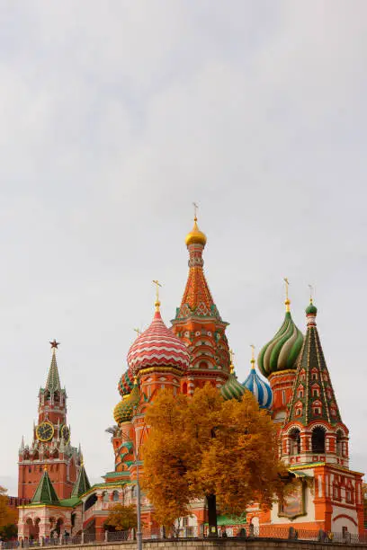Saint Basilâs Cathedral on Red Square of Moscow, Russia, Spassky (Saviorâs) tower of the Kremlin in autumn. Vertical photo. Travel or tourism theme or decoration