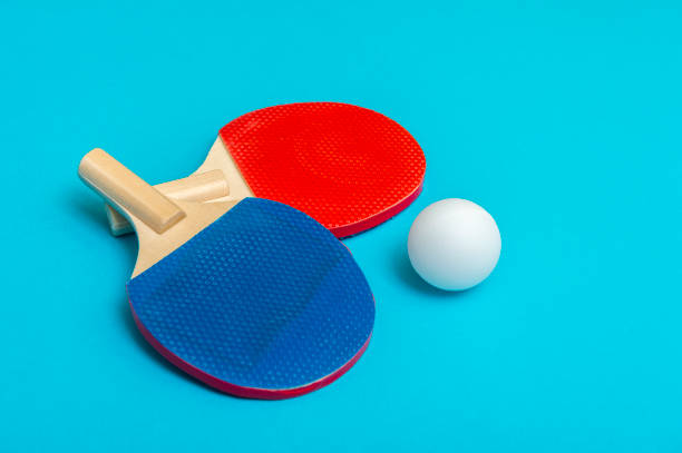 istock Two rackets for playing table tennis on blue background 1179445462