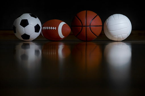 Close-up Of Various Sport Equipments Isolated On Black Background