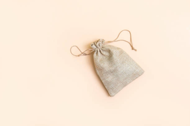 istock Money bag on light beige natural background 1179445633