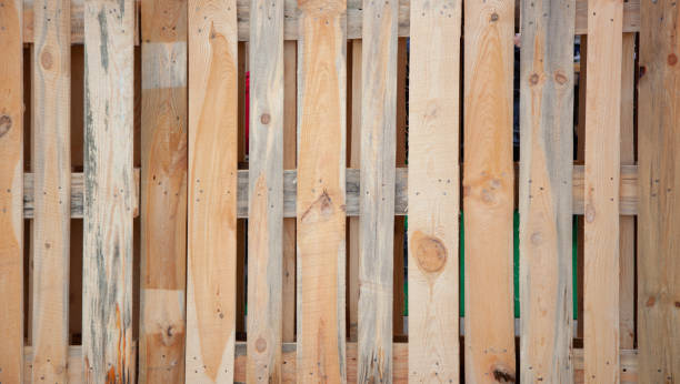 istock Wooden fence. Vertical boards knocked down by nails 1179446706
