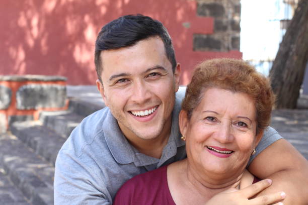 Hispanic senior woman with her son Hispanic senior woman with her son. hispanic grandmother stock pictures, royalty-free photos & images