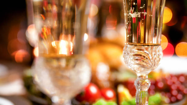 Closeup image of bubbles in champagne on family Christmas dinner