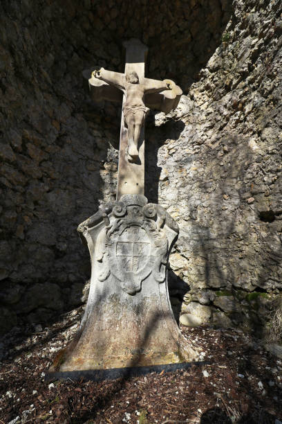 istock A stone cross in a cave. An old stone cross for pilgrims. 1179455954
