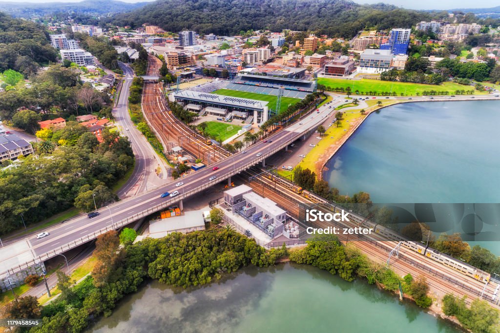 D Gosford Town No sky Gosford town CBD on Australian Central coast around train station and intersection of Central coast highway and railway with waterfront of Brisbane water - elevated aerial top down view. New South Wales Stock Photo