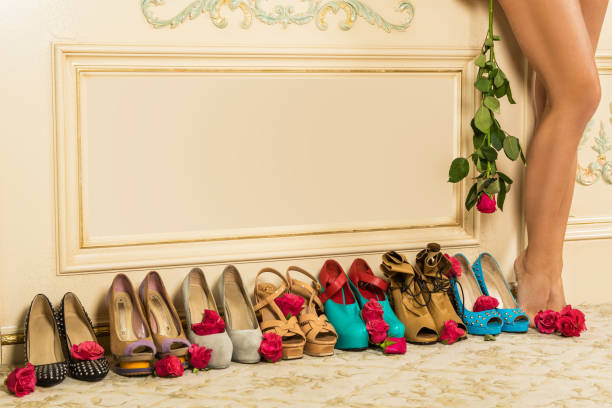 Different female shoes on high heels on the floor