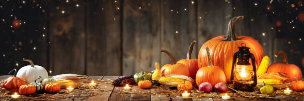 istock Wooden Table With Lantern And Candles Decorated With Pumpkins 1179461978