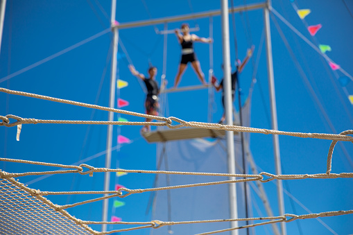 Trapeze artists ready to jump