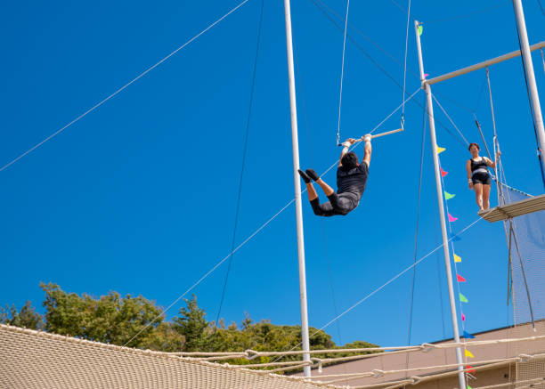 istock Trapeze artist flying in the sky 1179462148