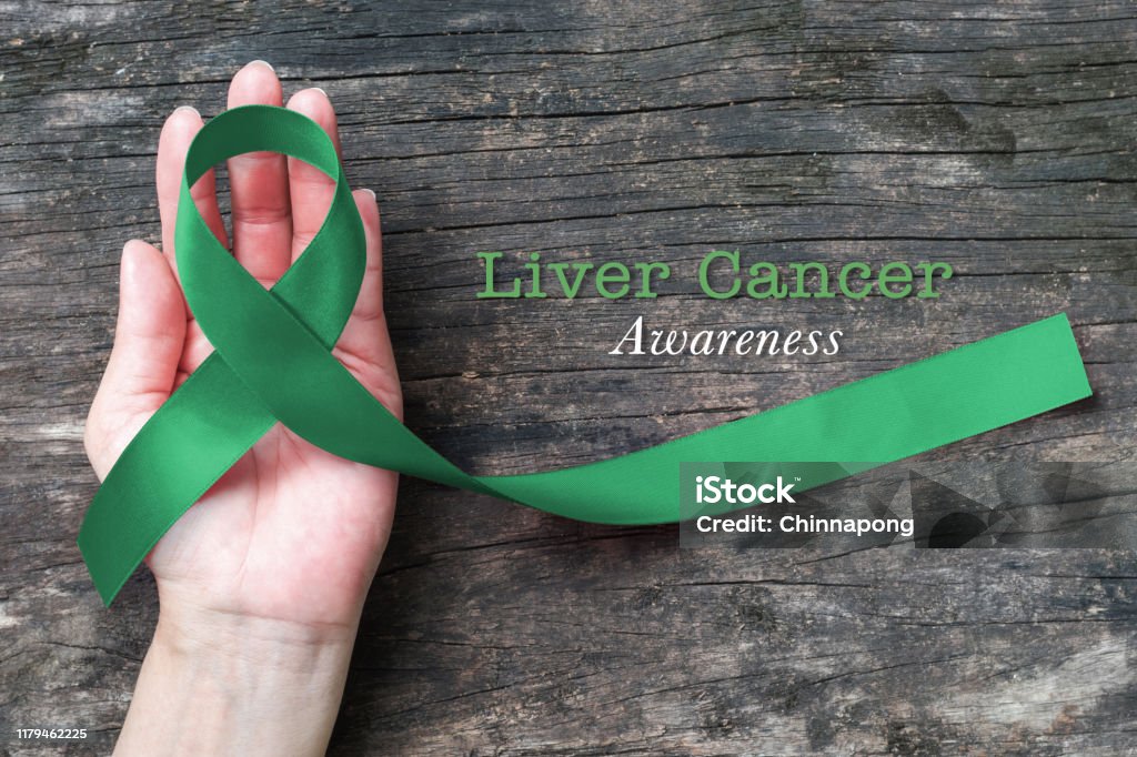 Emerald Green Ribbon Awareness Color On Helping Hand For Liver