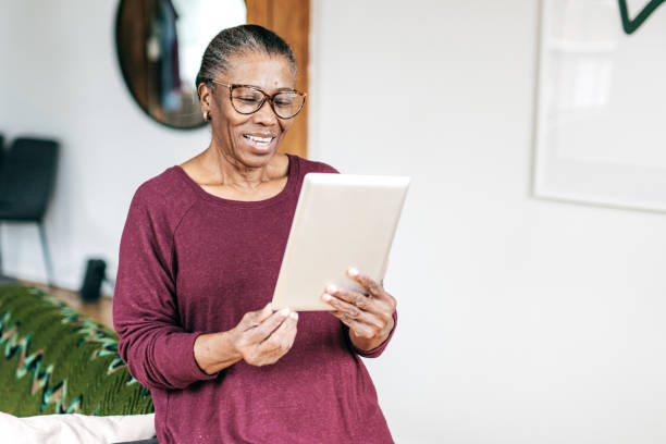 istock Senior women at home using tablet 1179462227
