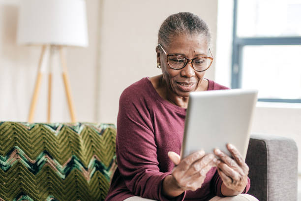 istock Senior women at home using tablet 1179462233