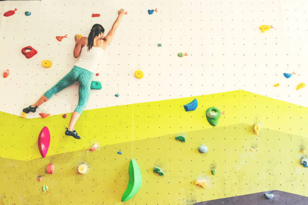 istock Woman in boulder gym. 1179463534