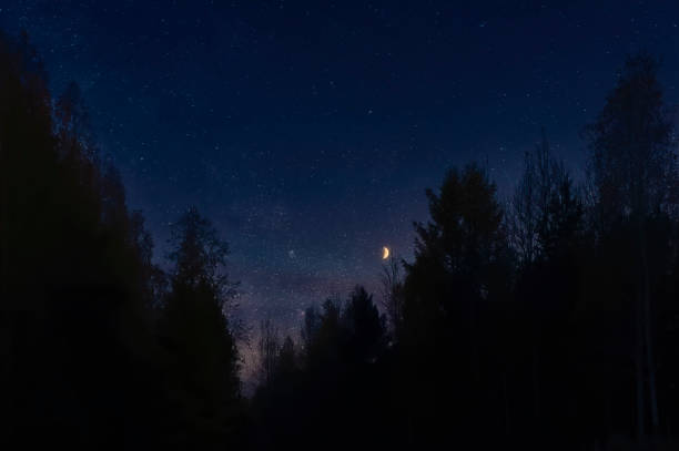 istock Stars and moon in night sky background during sunset. 1179466803
