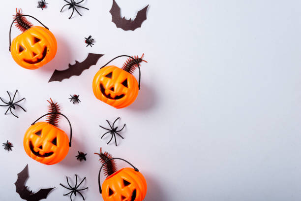 istock Halloween and decoration concept, Pumpkin with face, spiders, bats and centipede on gray background 1179473870