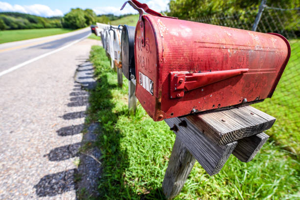 istock Mailboxes vintage style - old and new - on a bright sunny day in a suburb area 1179476203