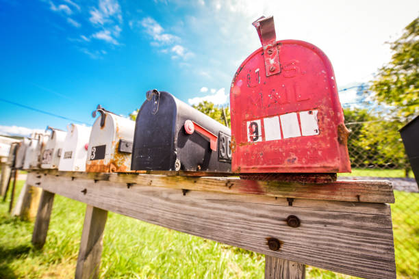 istock Mailboxes vintage style - old and new - on a bright sunny day in a suburb area 1179476205