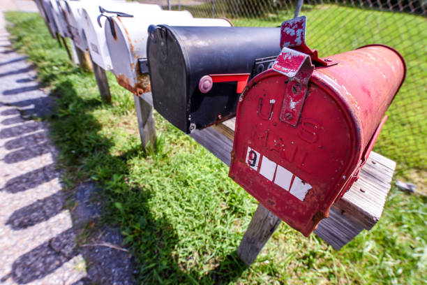 istock Mailboxes vintage style - old and new - on a bright sunny day in a suburb area 1179476206