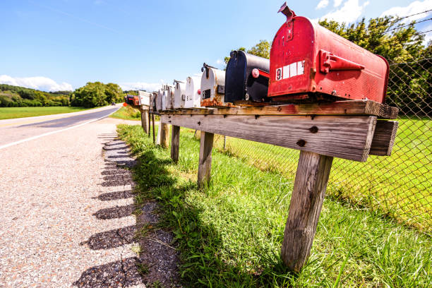 istock Mailboxes vintage style - old and new - on a bright sunny day in a suburb area 1179476208