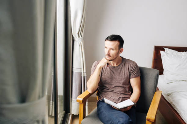 istock Man filling gratitude journal 1179479070