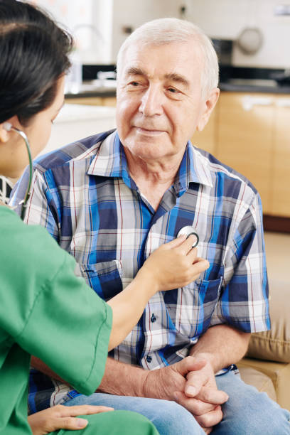 istock Medical worker checking patients heartbeat 1179482223