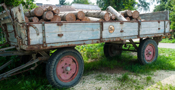 istock old trailer on a farmyard filled with firewood 1179483779