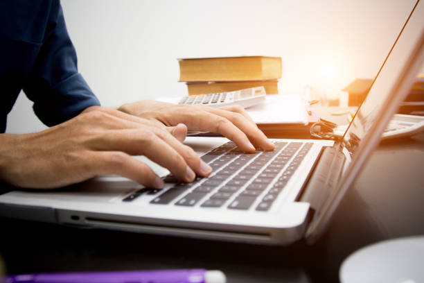 istock businessman working use laptop in office for discussing documents and ideas , with soft focus, vintage tone 1179487386