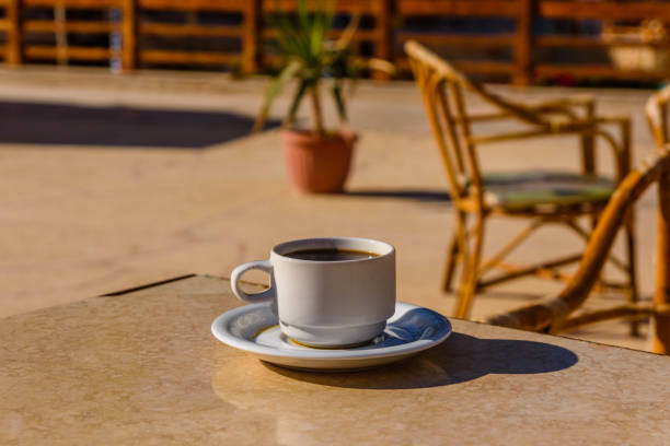 istock Cup of coffee on a table in street cafe 1179488268