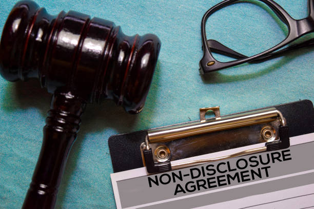 istock Non-Disclosure Agreement text on Document and gavel isolated on office desk. 1179491227