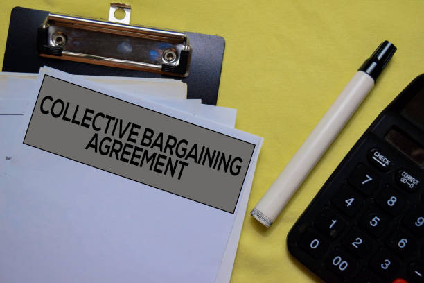 istock Collective Bargaining Agreement text on Document form isolated on office desk. 1179491315