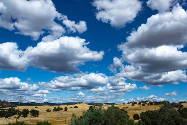 istock Fluffy Clouds above the prairie 1179491338