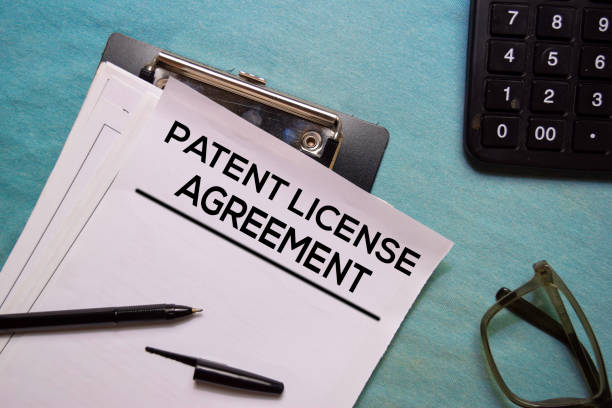 istock Patent Licence Agreement text on Document form isolated on office desk. 1179491427