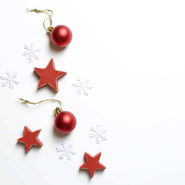 istock Winter christmas concept. Red baubles and star, snow on white background 1179491446