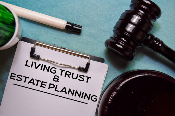 Living trust and Estate Planning text on Document form and Gavel isolated on office desk. stock photo