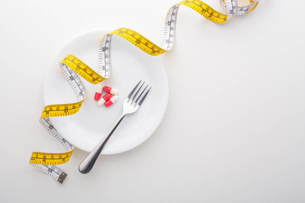 istock Diet, weight loss concept with pills, supplement on plate 1179496488