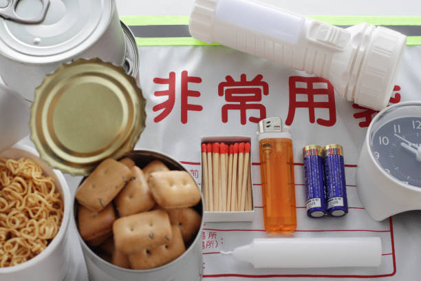 Emergency food at the time of disaster Emergency food at the time of disaster, dry bread, cup noodles, ramen, clock, battery, lighter, match, light bulb, candle, canned emergency shelter photos stock pictures, royalty-free photos & images
