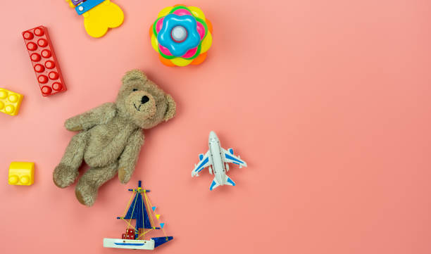 Table top view decoration kid toys for develop background concept.Flat lay accessories baby to play with items child on modern pink paper at office desk.Copy space for add text.pastel tone wallpaper.