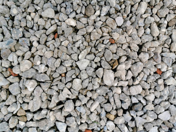 istock Gray gravel pebble stone texture. Small road stone background. 1179504671