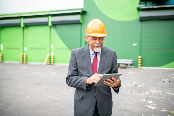 istock Male Inspector with Digital Tablet at Recycling Facility 1179506265