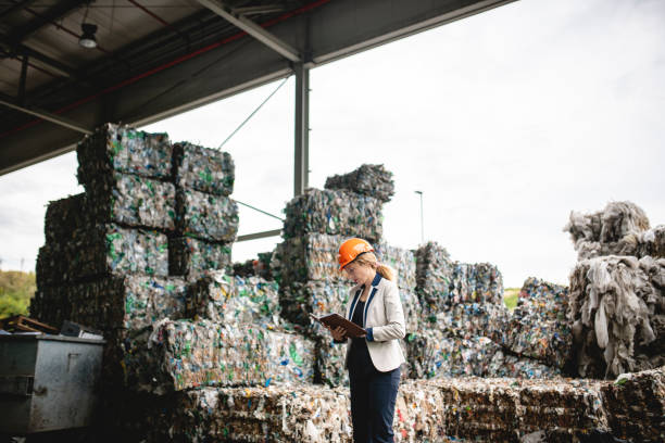 istock Female Recycling Inspector Checking Notes in Organizer 1179506300