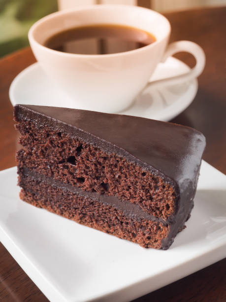 istock Slice of chocolate cake on a white plate. 1179506835