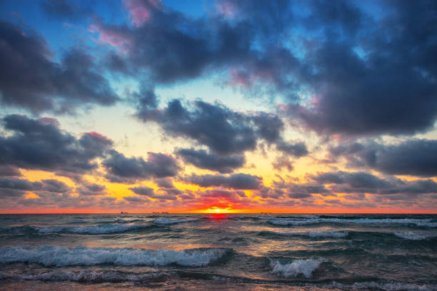 istock Beautiful cloudscape over the sea waves. Sunrise and tropical beach 1179507312