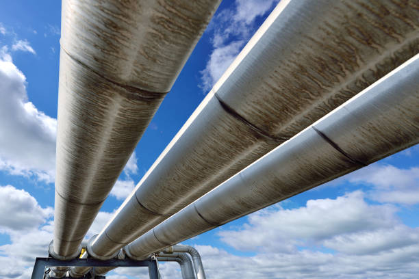 three pipeline reflecting blue sky - valve chemical plant oil industry imagens e fotografias de stock