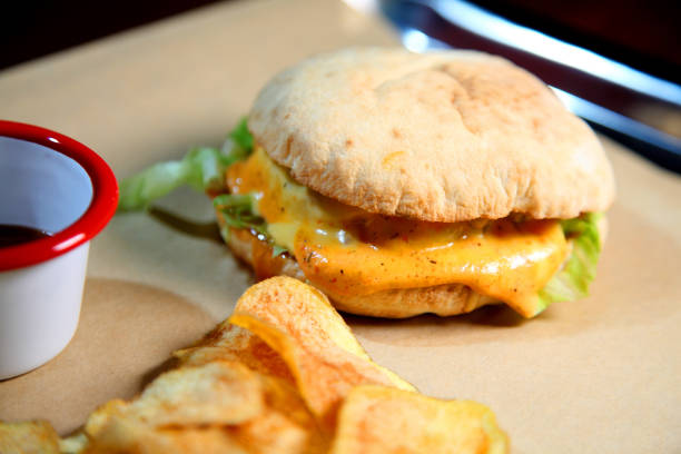 istock Burger with meat and vegetables. Double cheese burger.. Hot burger in a burning sauce. 1179511440