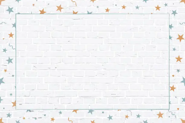 Vector illustration of Vector Illustration of a Christmas theme photo or picture frame in pale blue and orange coloured elements  stars,  swirls, twirls, confetti surrounding/ making a border of a white grunge textured brick wall