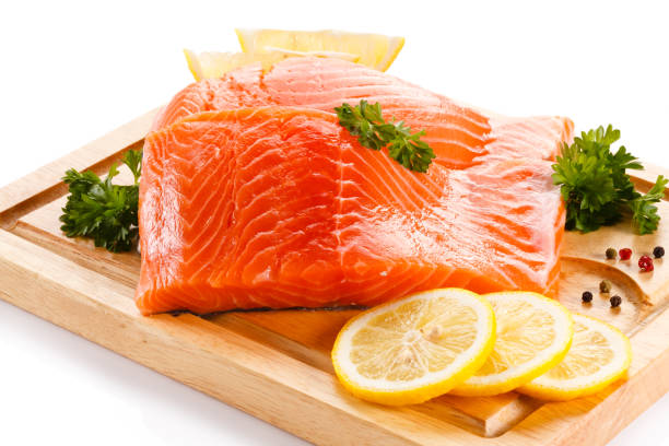 istock Fresh raw salmon steak on cutting board on white background 1179511659