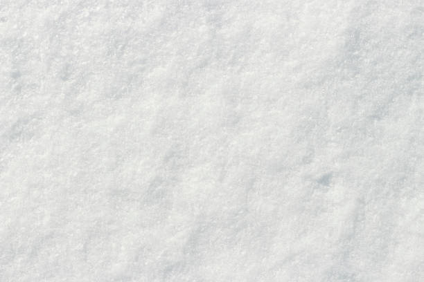 istock White snow shining in the sun close-up texture natural background 1179511747