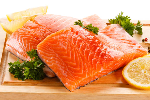 istock Fresh raw salmon steak on cutting board on white background 1179511770