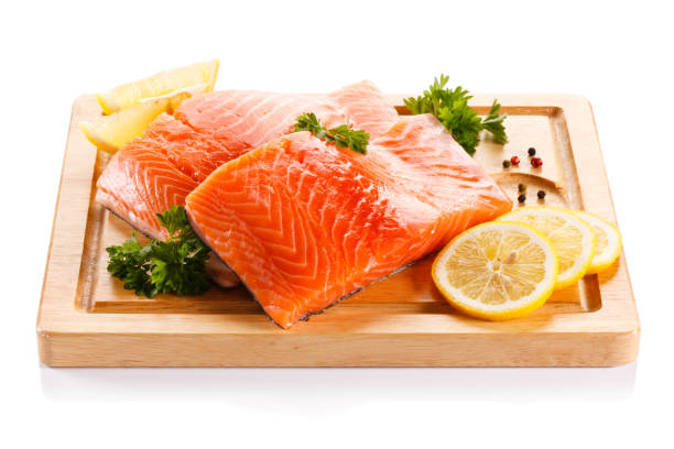 istock Fresh raw salmon steak on cutting board on white background 1179511813